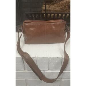 Aurielle Women’s Crossbody Purse Bag Brown Handbag with a shoulder strap.